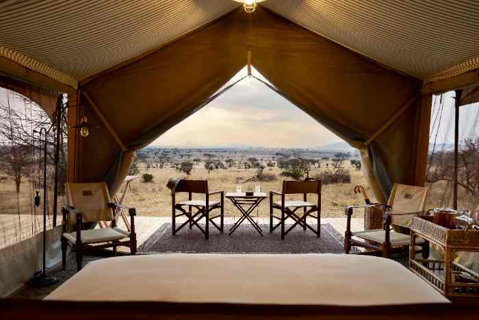 Tented suite interior, canvas and timber, in the Serengeti