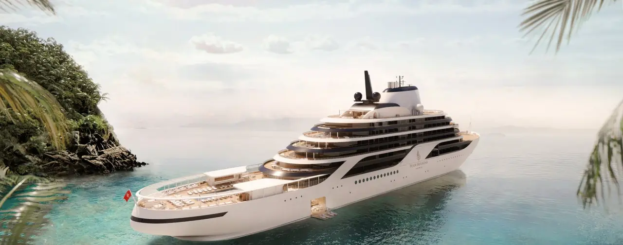 A Four Seasons yacht anchored in a turquoise bay