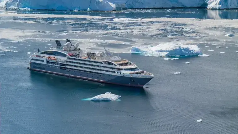 A Ponant expedition ship among icebergs in Antarctica