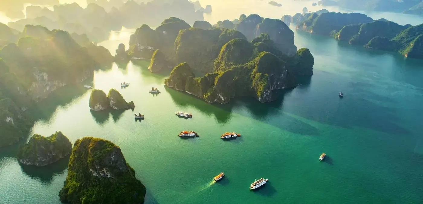Limestone islands rising from the emerald water of Ha Long Bay, Vietnam