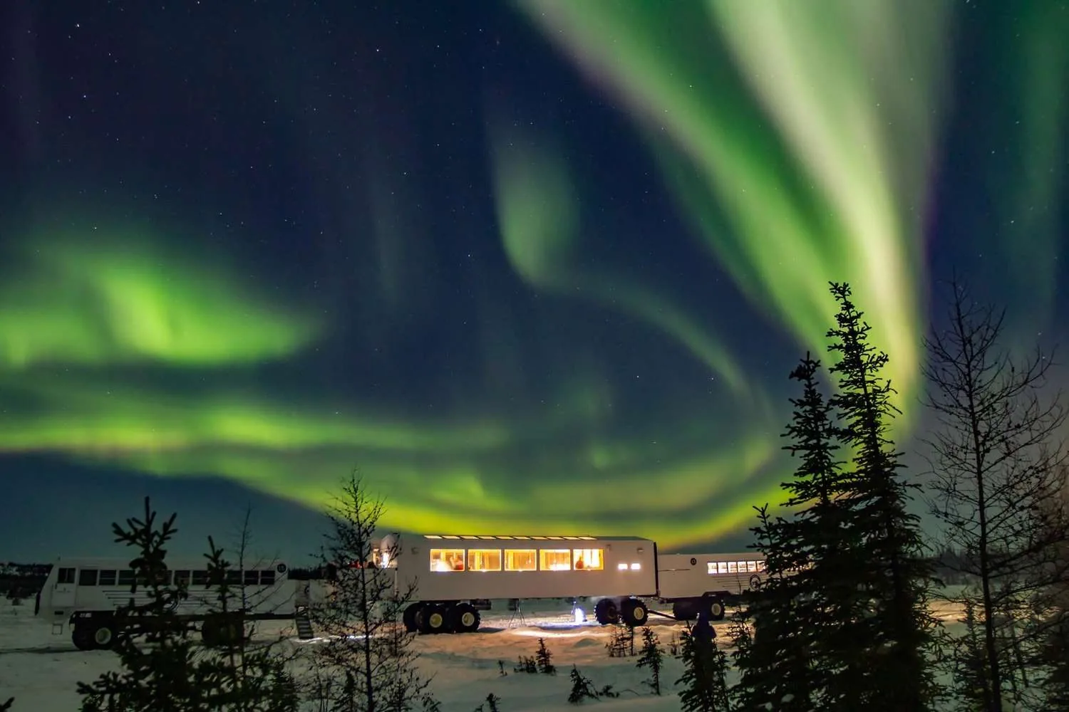 The Northern Lights over a tundra lodge near Churchill.