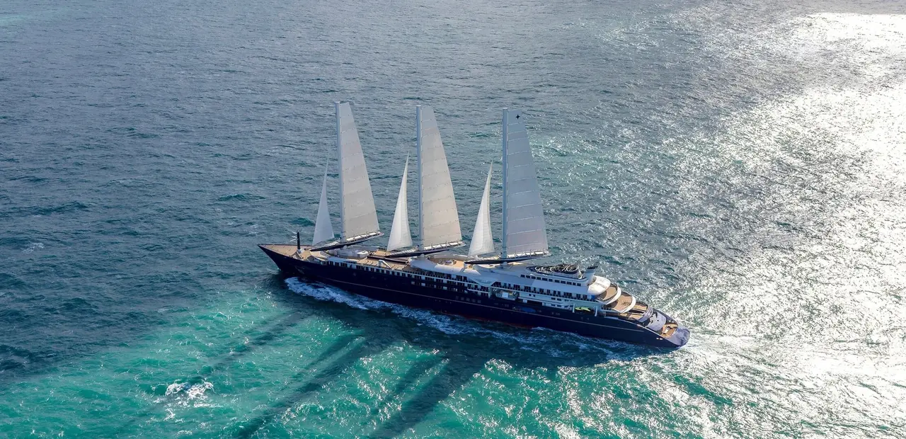 An Orient Express sailing yacht under sail on turquoise water