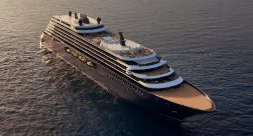 A Ritz-Carlton yacht at sea in golden evening light