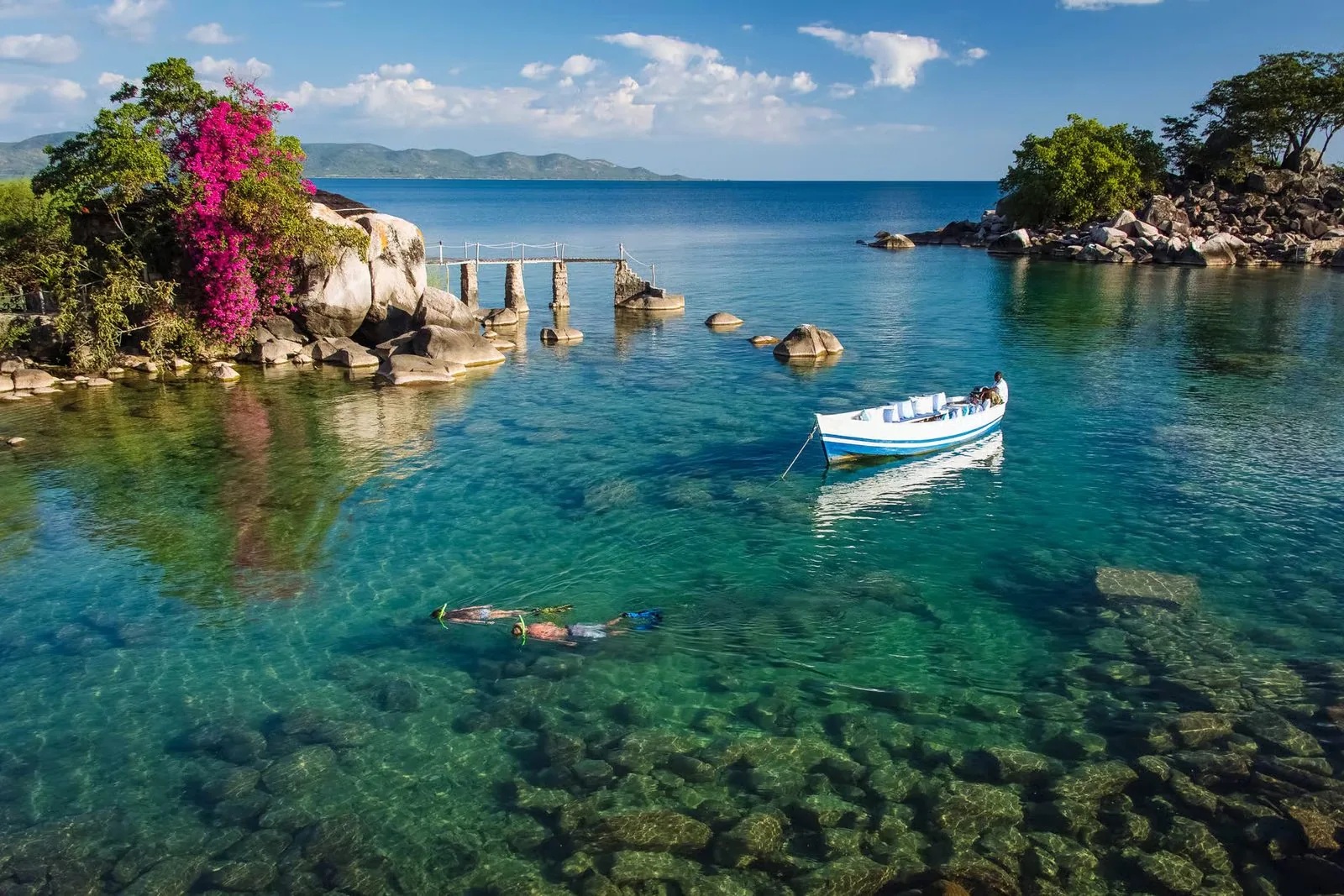Clear water and a rocky island on Lake Malawi.