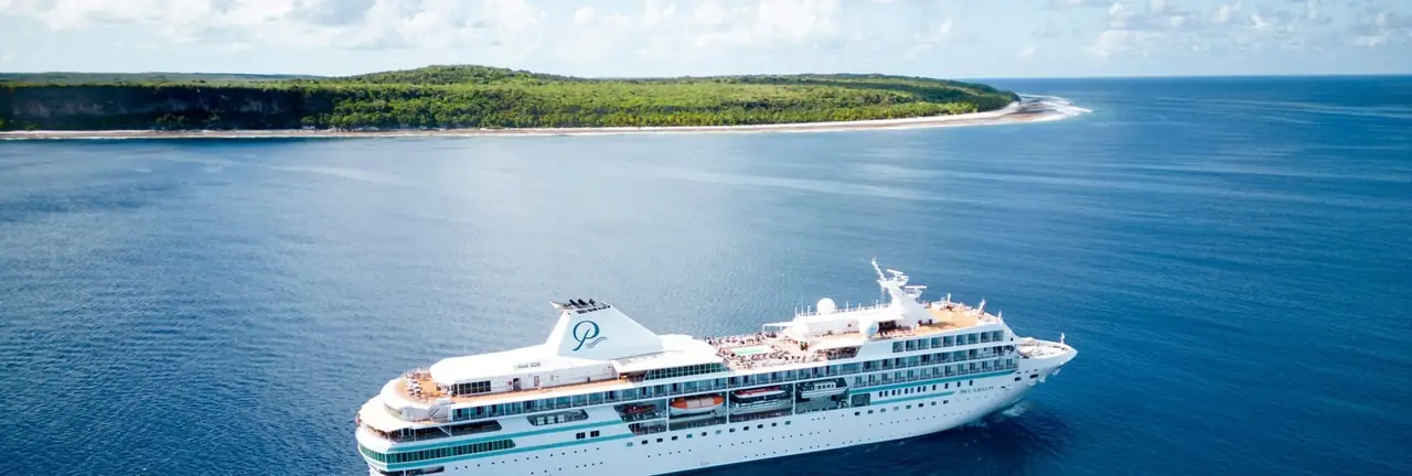 The Paul Gauguin off a tropical island in French Polynesia